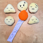 FurSniff Chips Bag Snuffle Toy Set with five plush potato toys, each with a unique embroidered face, and a purple fabric strip.