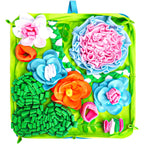 FurSniff floral snuffle mat for dogs, featuring colorful fleece flowers and hiding spots for treats. Green base with pink, blue, and orange accents.