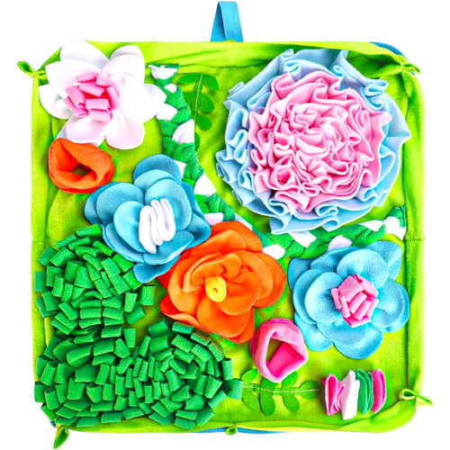 FurSniff floral snuffle mat for dogs, featuring colorful fleece flowers and hiding spots for treats. Green base with pink, blue, and orange accents.